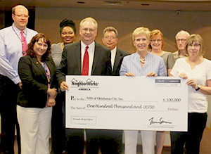 NHS and State Superintendent Janet Barresi receive big check from NeighborWorks America