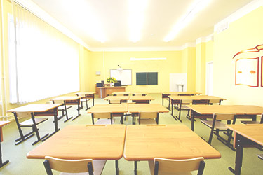 empty, bright yellow classroom