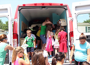 Mobile book van with parents and kids